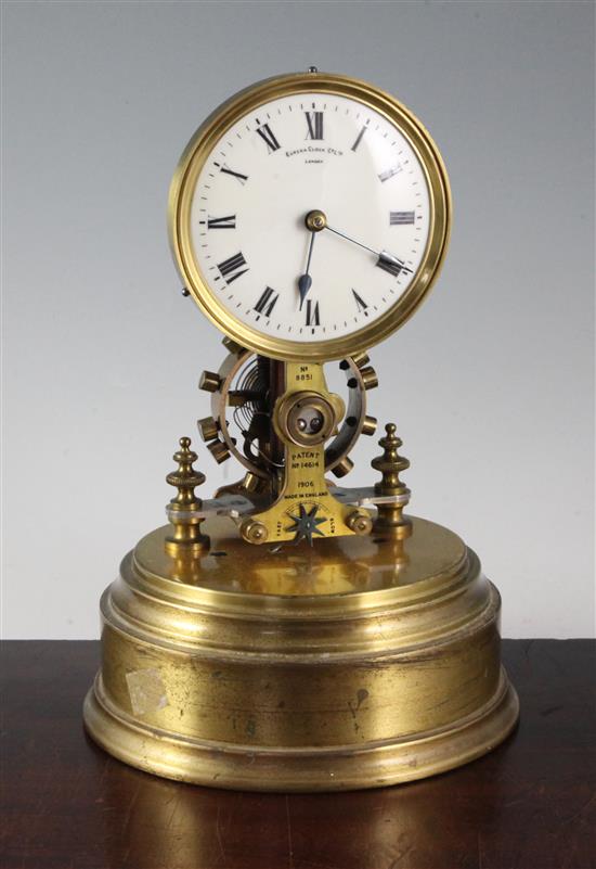 A Eureka Clock Co Ltd lacquered brass patent electric timepiece, height overall 13in., glass dome associated